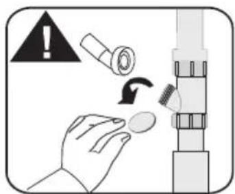 Diagram illustrating a hand holding a small object with a warning symbol and clockwise arrow indicating rotation or adjustment.