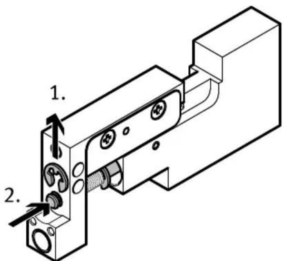 Technical diagram of a mechanical assembly with numbered components and directional arrows indicating movement or force.