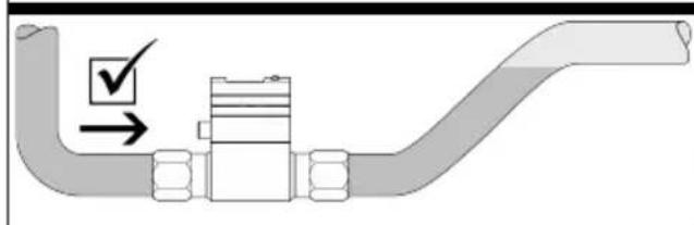 Diagram of a pipe fitting with checkmark and arrow indicating inspection or status