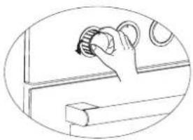 Line drawing of a hand operating a mechanical switch with rotating parts (no text or symbols)