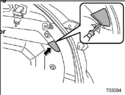 Technical diagram showing car seatbelt mechanism with labeled parts and a magnified inset view