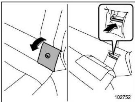 Diagram showing car seatbelt buckle adjustment with magnified detail view