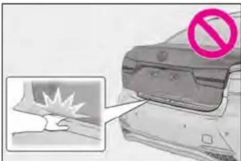 Diagram showing a car with a 'no' symbol and a magnified inset of a damaged surface, likely indicating a hazard or damage.