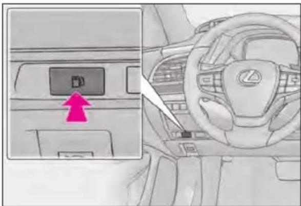 Diagram of car interior showing dashboard control panel with a highlighted drive button and directional arrow