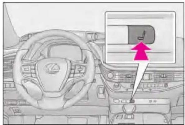Diagram of a car interior with steering wheel, dashboard, and directional arrow indicating a specific component