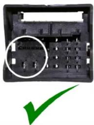 Close-up of a black electronic component with a circled detail and a green checkmark (no text or symbols visible)