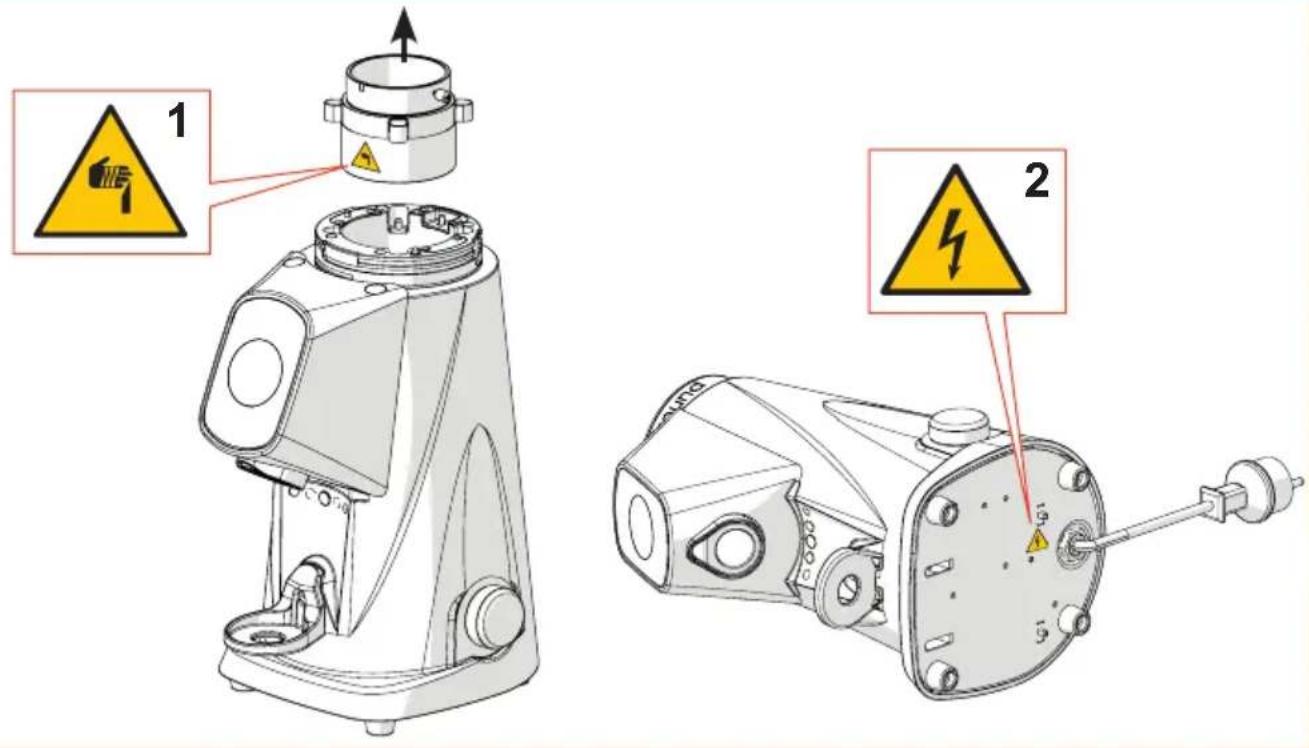 Technical diagram showing two mechanical components with warning labels and safety warning symbols