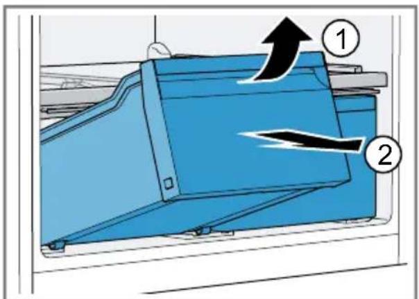 Diagram of a blue industrial machine with labeled components and directional arrows indicating flow or movement.