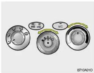 Diagram showing three circular gauges with labeled controls and directional arrows, likely illustrating a system or control mechanism.