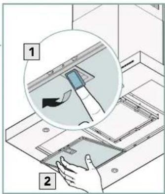 Diagram showing a hand inserting a device into a device with labeled parts, including a magnified inset view.