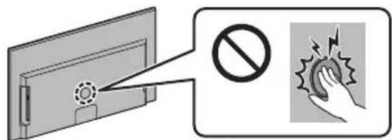 Safety warning illustration showing a device with a circular component and a hand touching a button with a warning symbol.