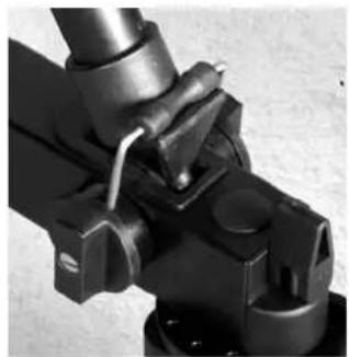 Close-up of a hand gripping a mechanical component (no visible text or symbols)