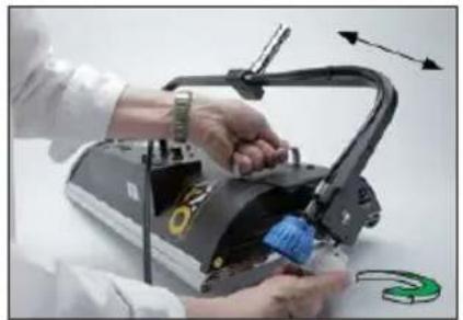 Close-up of hands assembling a 3D printer with a blue plastic clip, no visible text or symbols