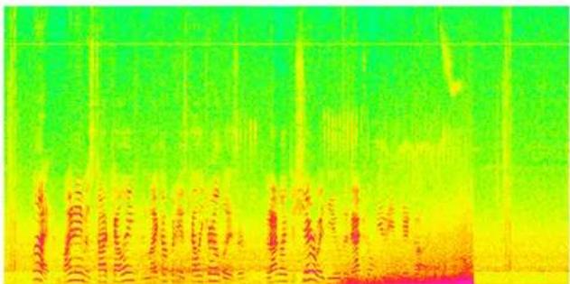 Scanned text of a document with dense, colorful vertical columns and horizontal lines, likely from a technical or academic paper.