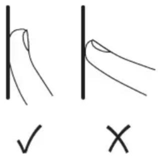 Hand-drawn diagrams showing correct and incorrect hand positions with checkmark and cross symbols