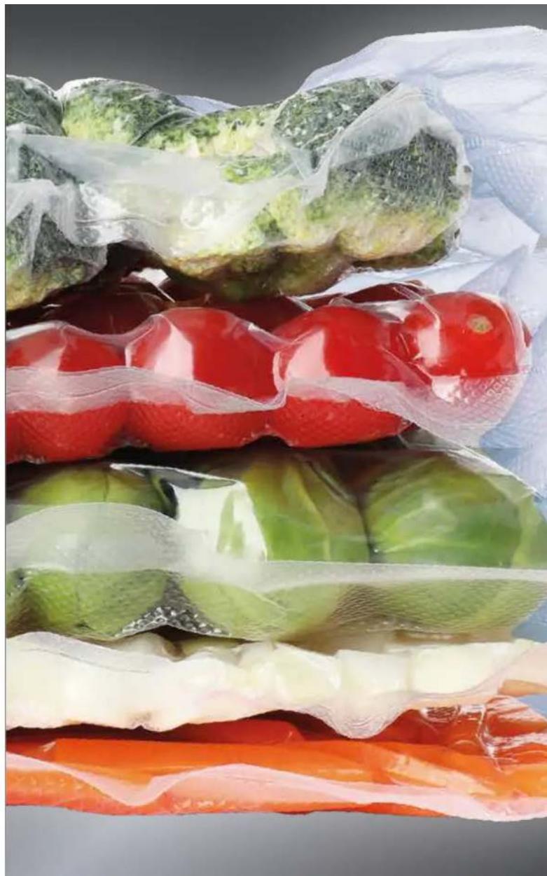 Stacked packaged vegetables including broccoli, red peppers, and green peppers wrapped in plastic bags (no text or symbols visible)