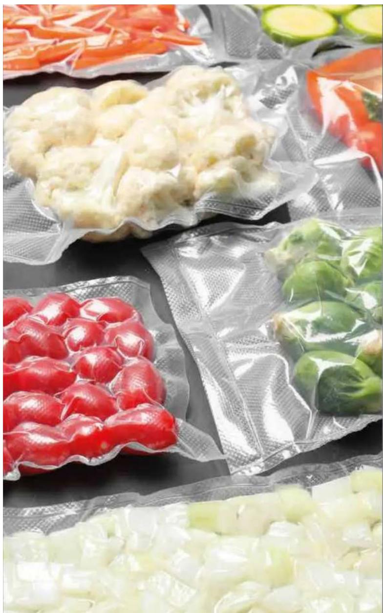 Assorted packaged vegetables and refrigerated food items, including tomatoes, peppers, broccoli, and radishes (no text or labels visible)