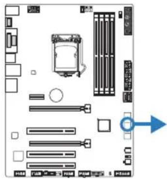 Diagram of a computer motherboard layout with labeled components and directional arrow indicating orientation