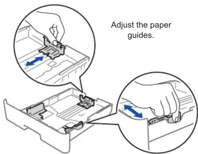 Adjust the paper guides.