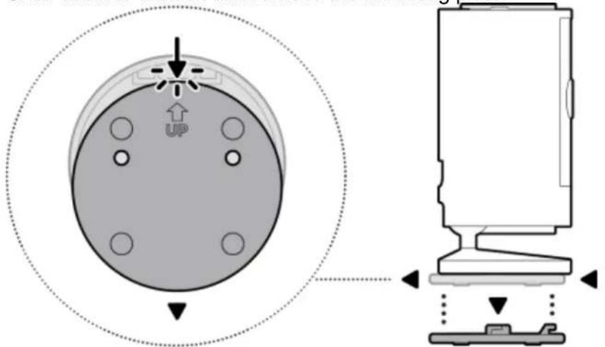Diagram showing a device with an upward arrow labeled 'UP' pointing to a circular component, alongside its exploded view.