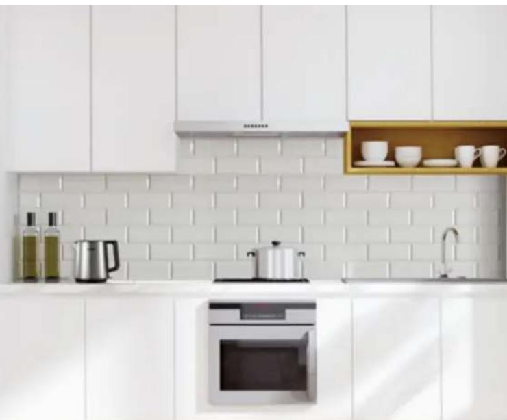 Modern kitchen interior with white cabinetry, oven, and kitchenware (no visible text or symbols)