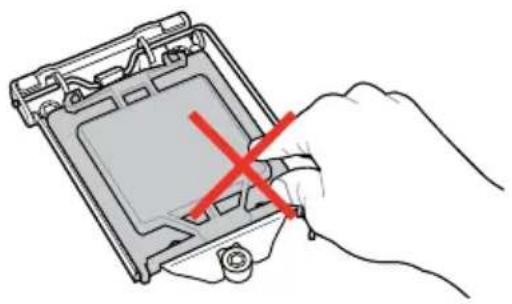 Hand holding a hard drive component with a red X mark, no text or symbols visible