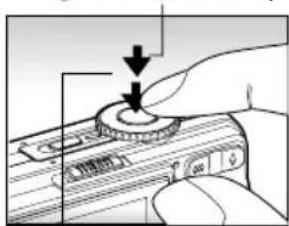 Diagram showing a hand pressing down on a device's dial with arrows indicating downward motion