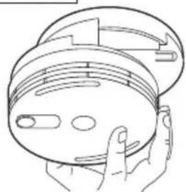 Line drawing of a hand holding a circular device with internal components (no text or symbols)