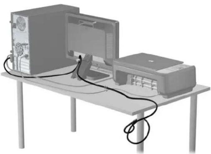 Illustration of a desktop computer setup with monitor, tower, and printer connected by cables (no text or symbols visible)