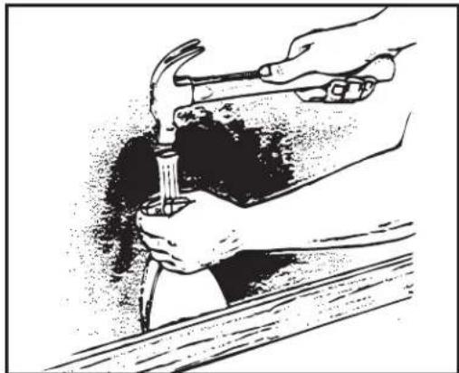 Illustration of hands using a hammer to press or install a piece of material, no text or symbols present