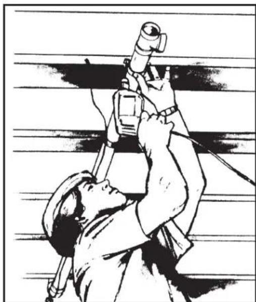 Black-and-white illustration of a person using a handheld device (no text or symbols visible)