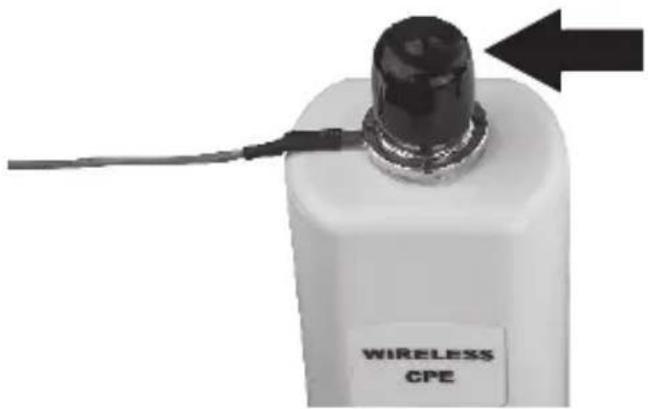 Close-up of a white cylindrical device with a black top and cable, labeled 'WIRELESS CPE' (no additional text or symbols visible)