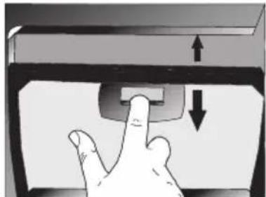 Hand pressing a button on a computer monitor (no text or symbols visible)