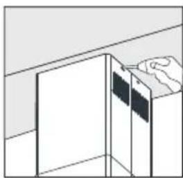 Simple line drawing of a cabinet or cabinet with a hand holding the top panel (no text or symbols)