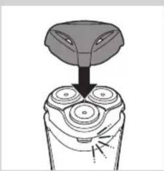 Diagram of a hand turning a three-pin electric shaver (no text or symbols)