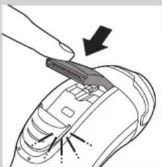 Diagram of a device being inserted into a component, showing a tool and arrow indicating direction (no text or symbols present)