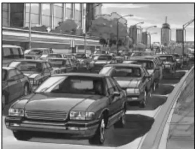 Black-and-white street scene showing a busy urban traffic with multiple cars and modern buildings in the background (no visible text or signage)