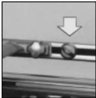 Close-up of a mechanical component with a downward arrow indicator (no text or symbols)