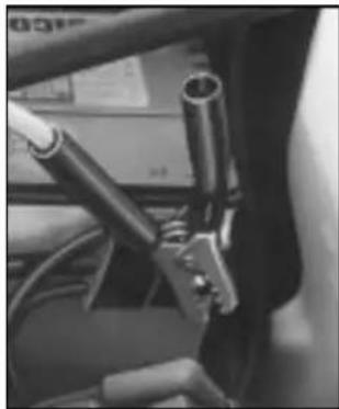 Close-up of a car's front wheel and dashboard assembly (no visible text or symbols)