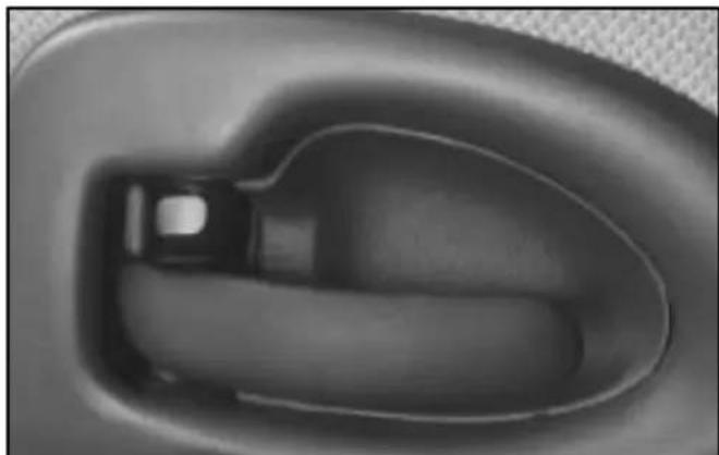 Close-up of a car seatbelt buckle (no text or symbols visible)