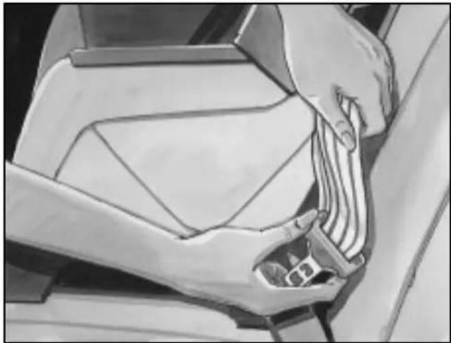 Close-up of a hand adjusting a car seatbelt mechanism (no text or symbols visible)
