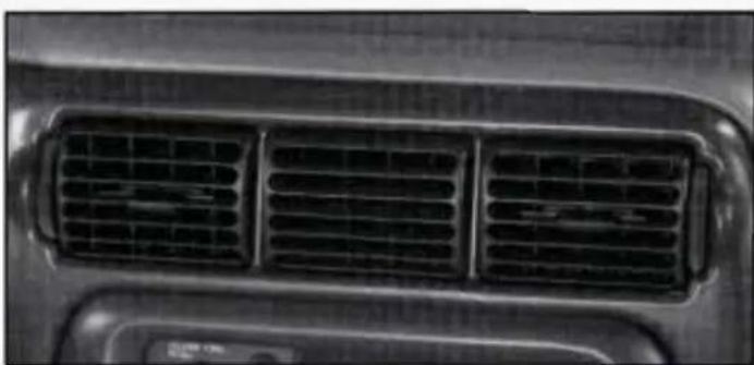 Close-up of a car's front grille with visible heat sinks and ventilation grilles (no text or symbols)