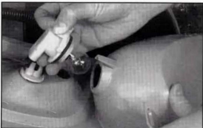 Close-up of hands performing a medical procedure on a patient's arm, no visible text or symbols