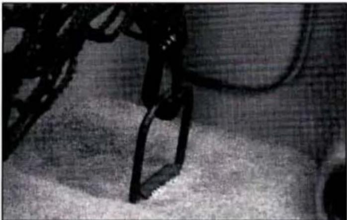Close-up of a robotic hand and foot in motion, possibly a robotic or mechanical device (no visible text or symbols)