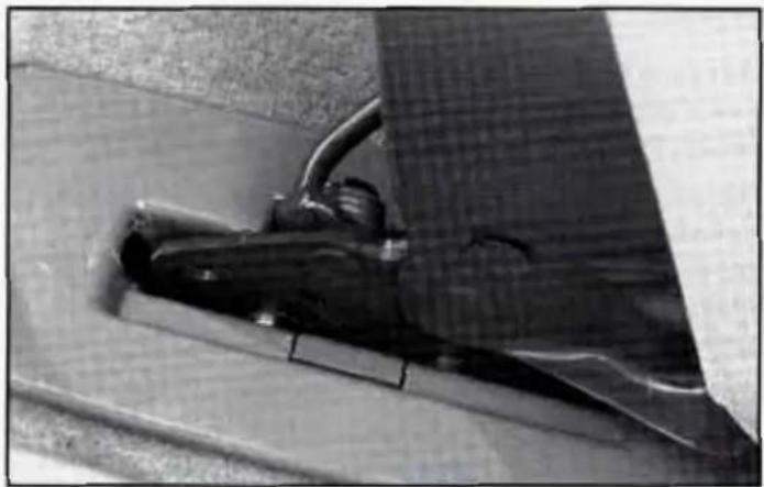 Close-up of a mechanical component mounted on a textured surface, no visible text or symbols