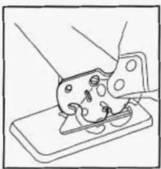 Line drawing of a mechanical assembly with hands operating a component (no text or symbols)