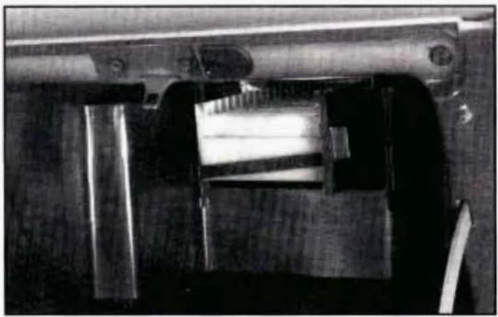 Close-up of a mechanical component with metallic parts and a cylindrical shaft (no visible text or symbols)