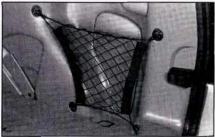 Close-up of a mechanical component with a meshed grid and mounting holes (no visible text or symbols)