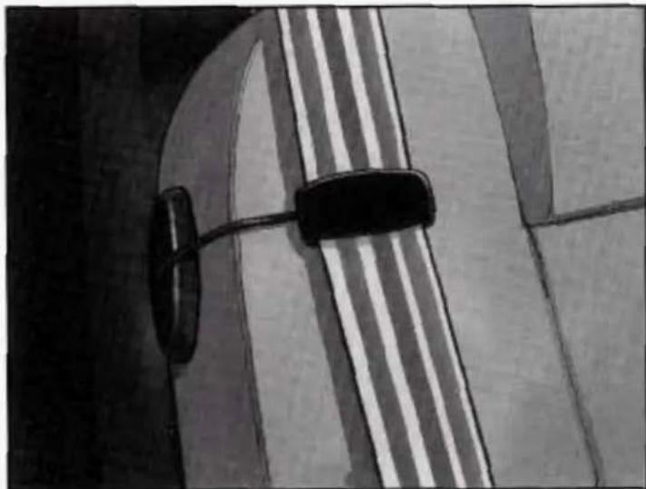 Close-up of a car's front wheel and side mirror (no visible text or symbols)