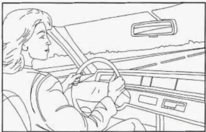 Line drawing of a person driving a car with steering wheel and dashboard (no text or symbols)